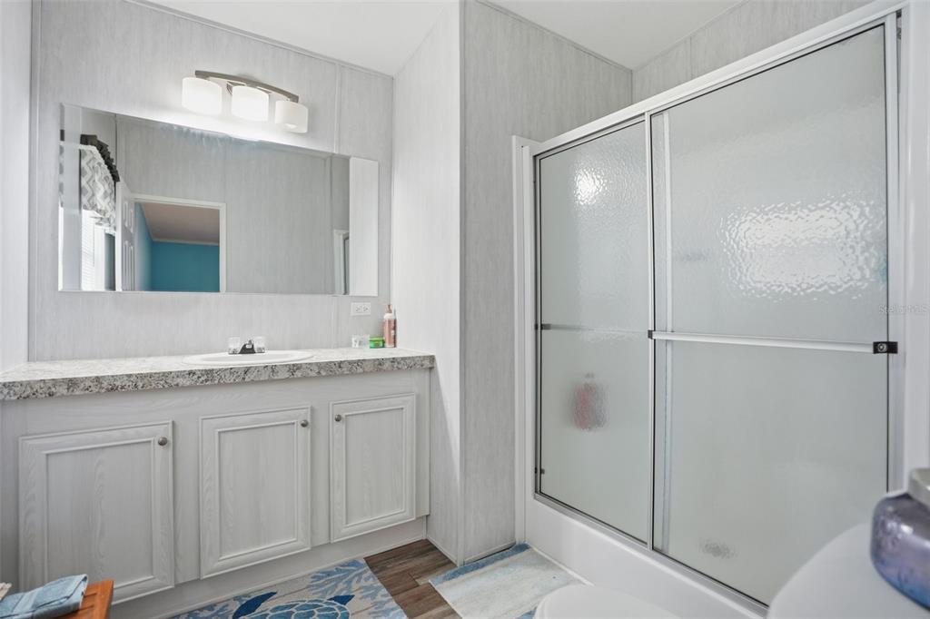 9100 Highpoint Boulevard Brooksville, FL 34613 - Photo 19 of 42 a bathroom with a granite countertop sink mirror and toilet