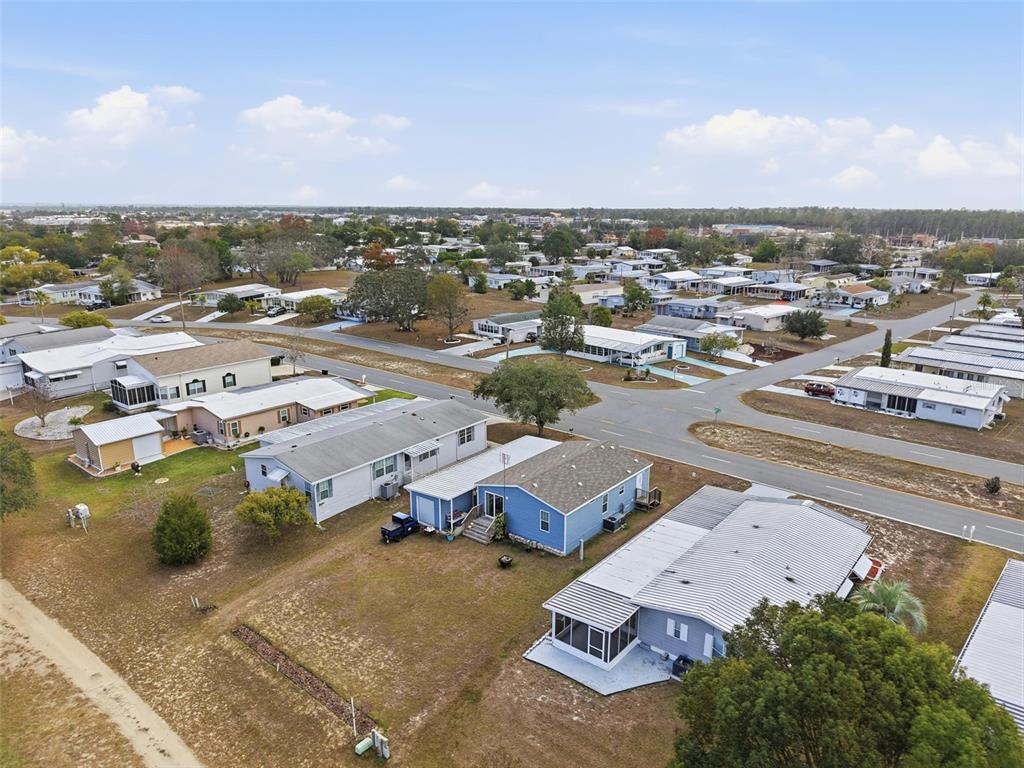 9100 Highpoint Boulevard Brooksville, FL 34613 - Photo 22 of 42 an aerial view of residential houses with outdoor space