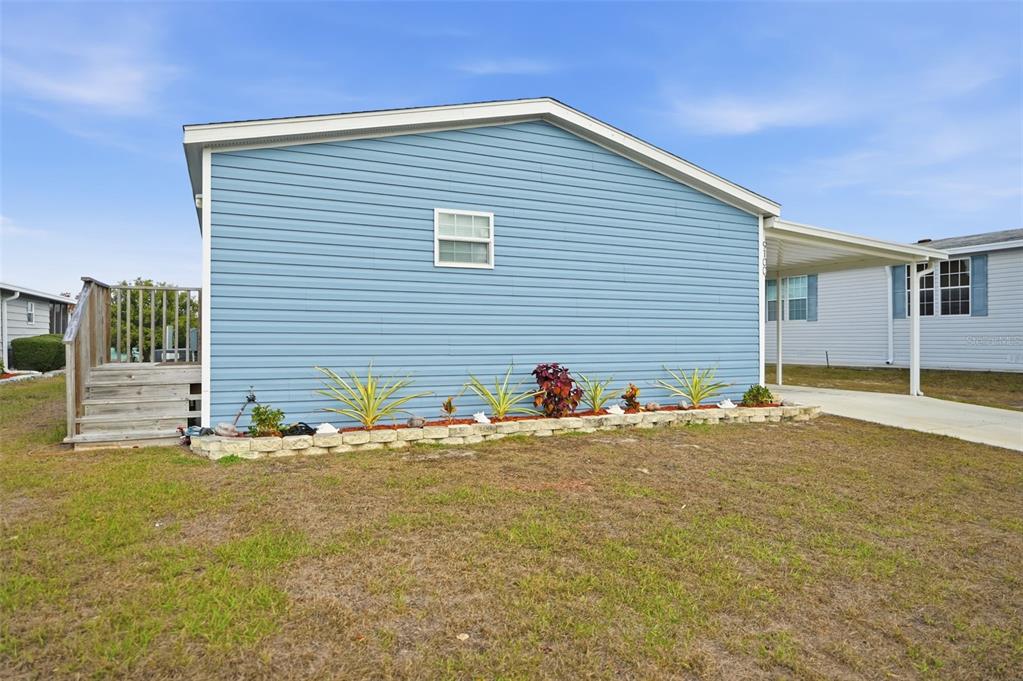 9100 Highpoint Boulevard Brooksville, FL 34613 - Photo 3 of 42 a view of a house with a backyard