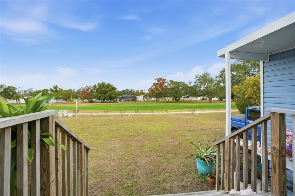 9100 Highpoint Boulevard Brooksville, FL 34613 - Photo 4 of 42 a view of a balcony with lake and trees