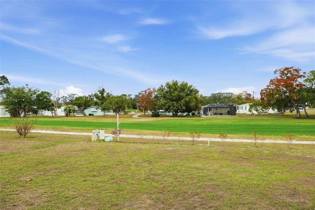 9100 Highpoint Boulevard Brooksville, FL 34613 - Photo 5 of 42 a view of building with outdoor space and swimming pool