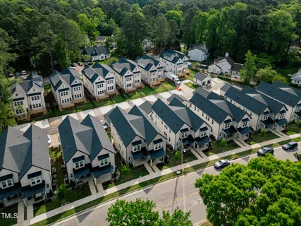 an aerial view of a house with yard swimming pool and outdoor seating