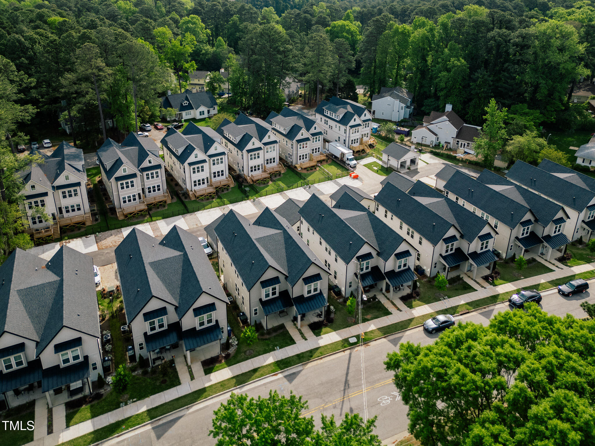 an aerial view of a house with yard swimming pool and outdoor seating