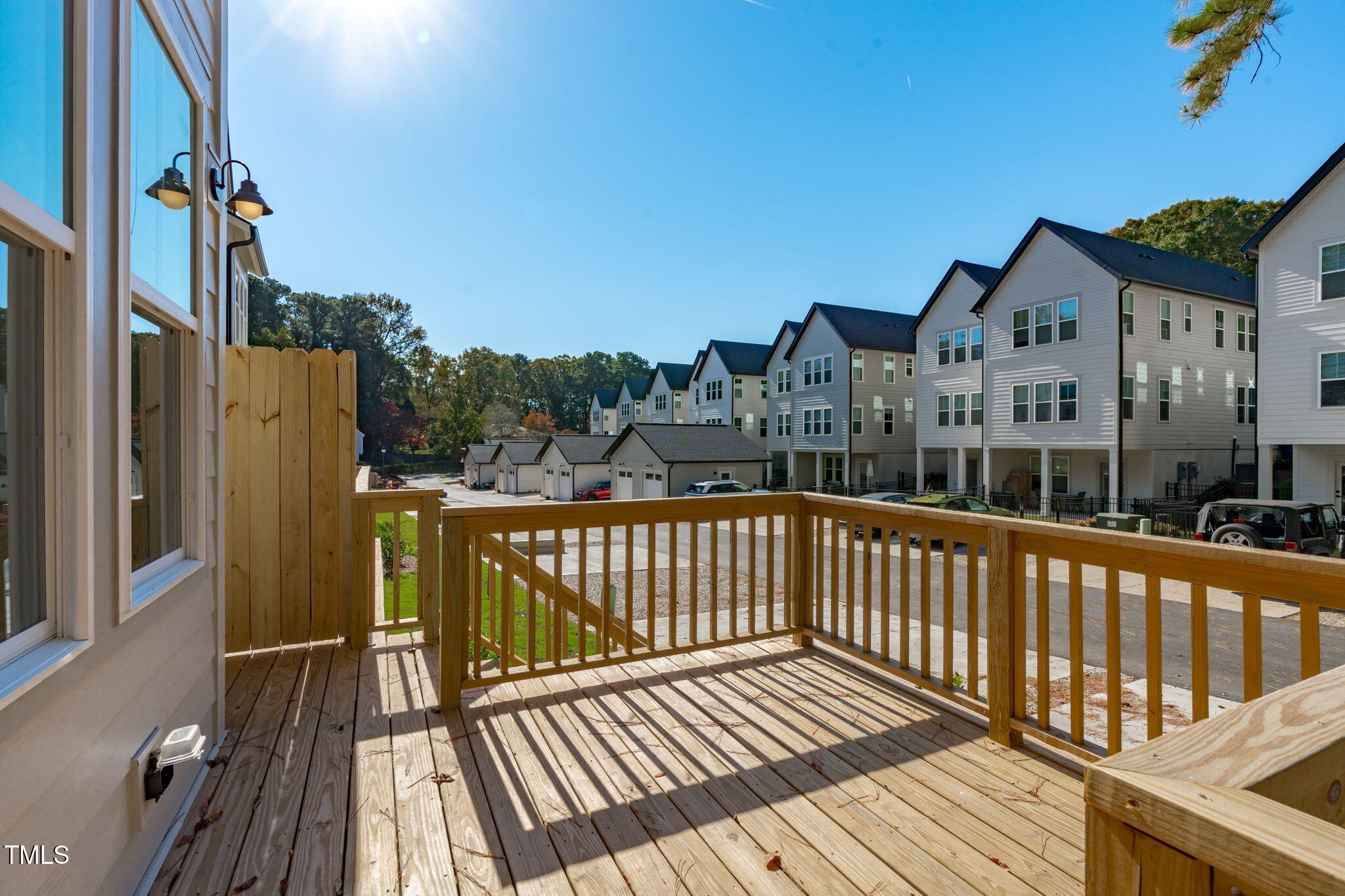5061 Lundy Drive, Unit 101 Raleigh, NC 27606 - Photo 14 of 56 a view of a houses with a balcony