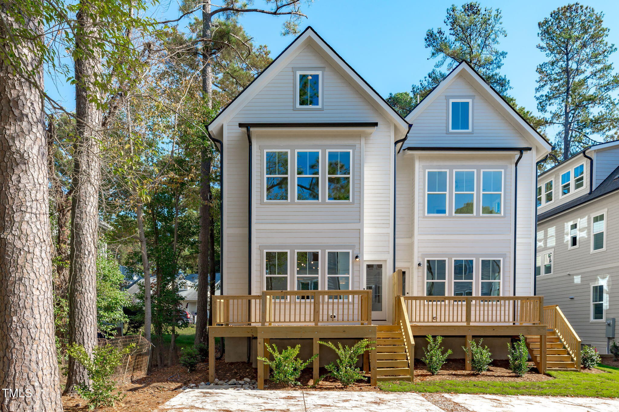 5061 Lundy Drive, Unit 101 Raleigh, NC 27606 - Photo 15 of 56 a front view of a house with a yard
