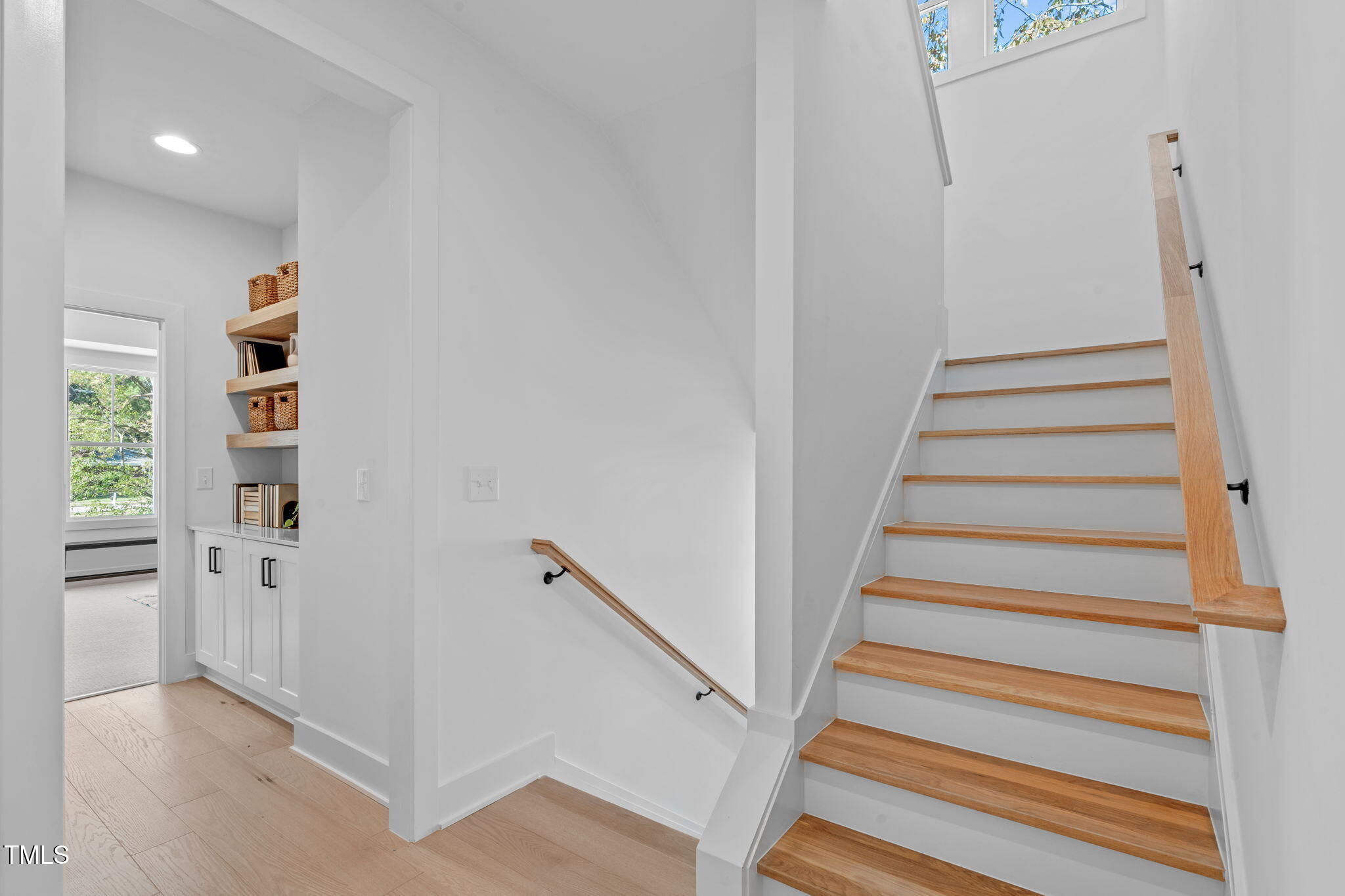 5061 Lundy Drive, Unit 101 Raleigh, NC 27606 - Photo 17 of 56 a view of entryway with wooden floor and stairs