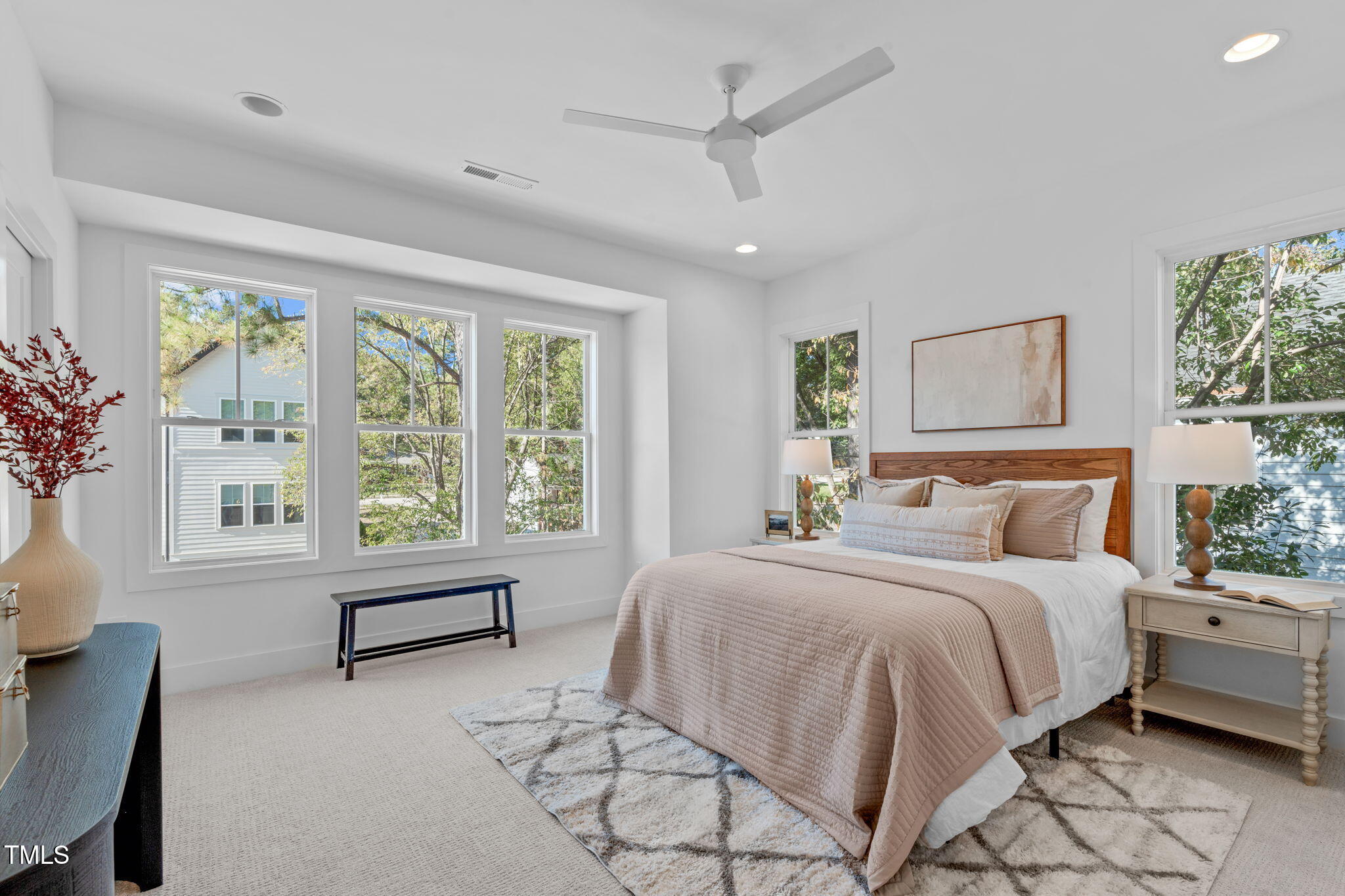 5061 Lundy Drive, Unit 101 Raleigh, NC 27606 - Photo 19 of 56 a bedroom with a large bed and a large window
