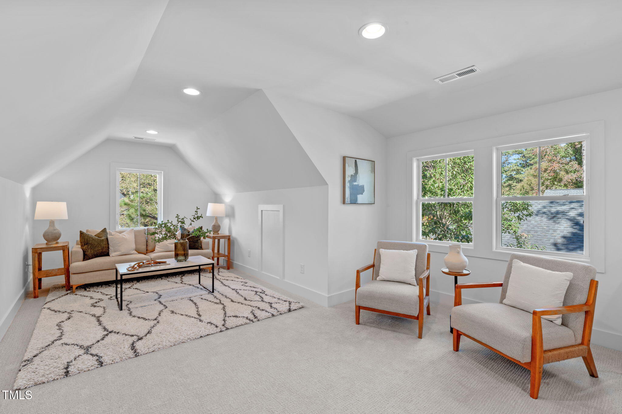 5061 Lundy Drive, Unit 101 Raleigh, NC 27606 - Photo 30 of 56 a living room with furniture and a large window