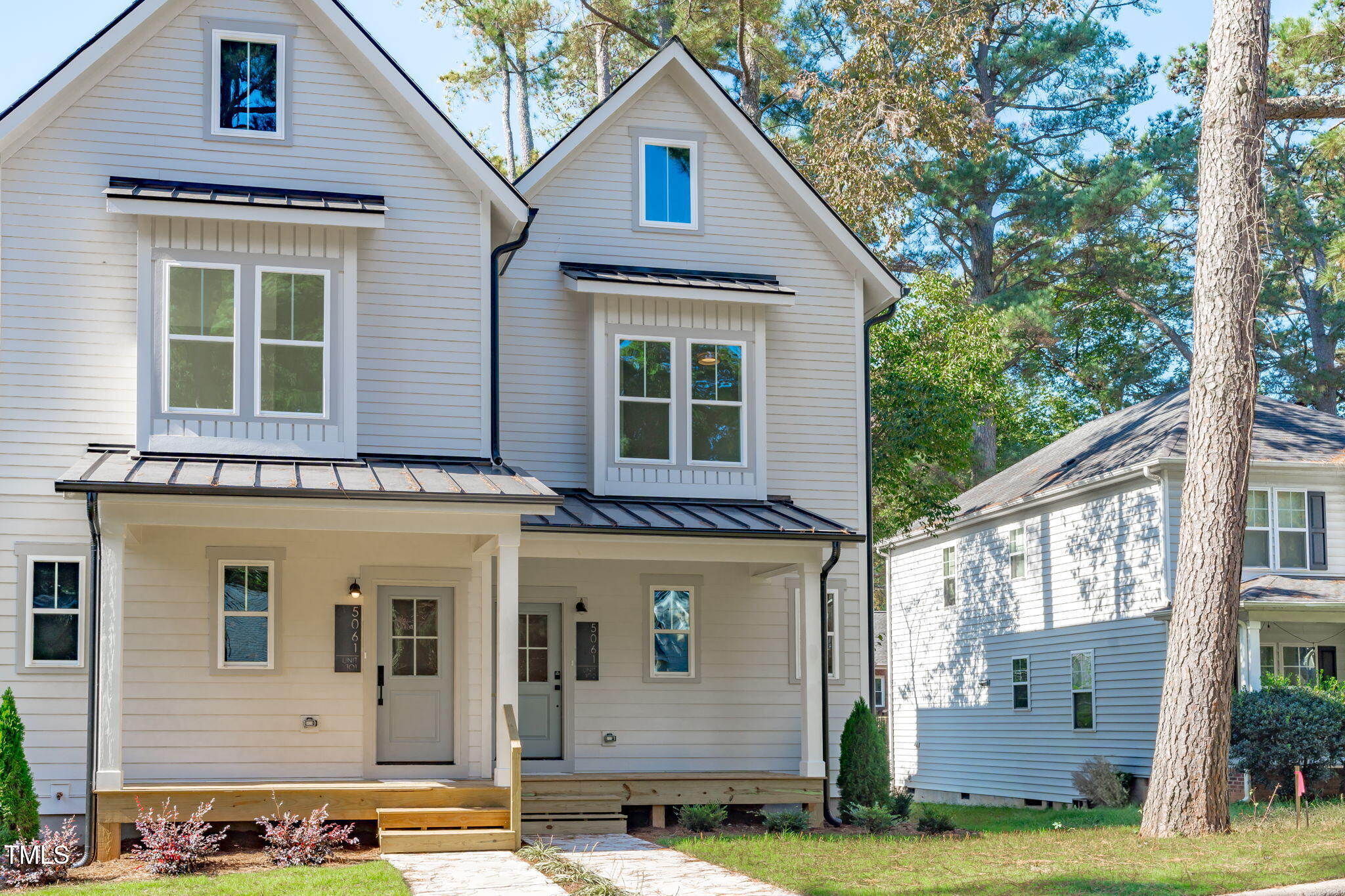 5061 Lundy Drive, Unit 101 Raleigh, NC 27606 - Photo 39 of 56 a view of a house with a yard