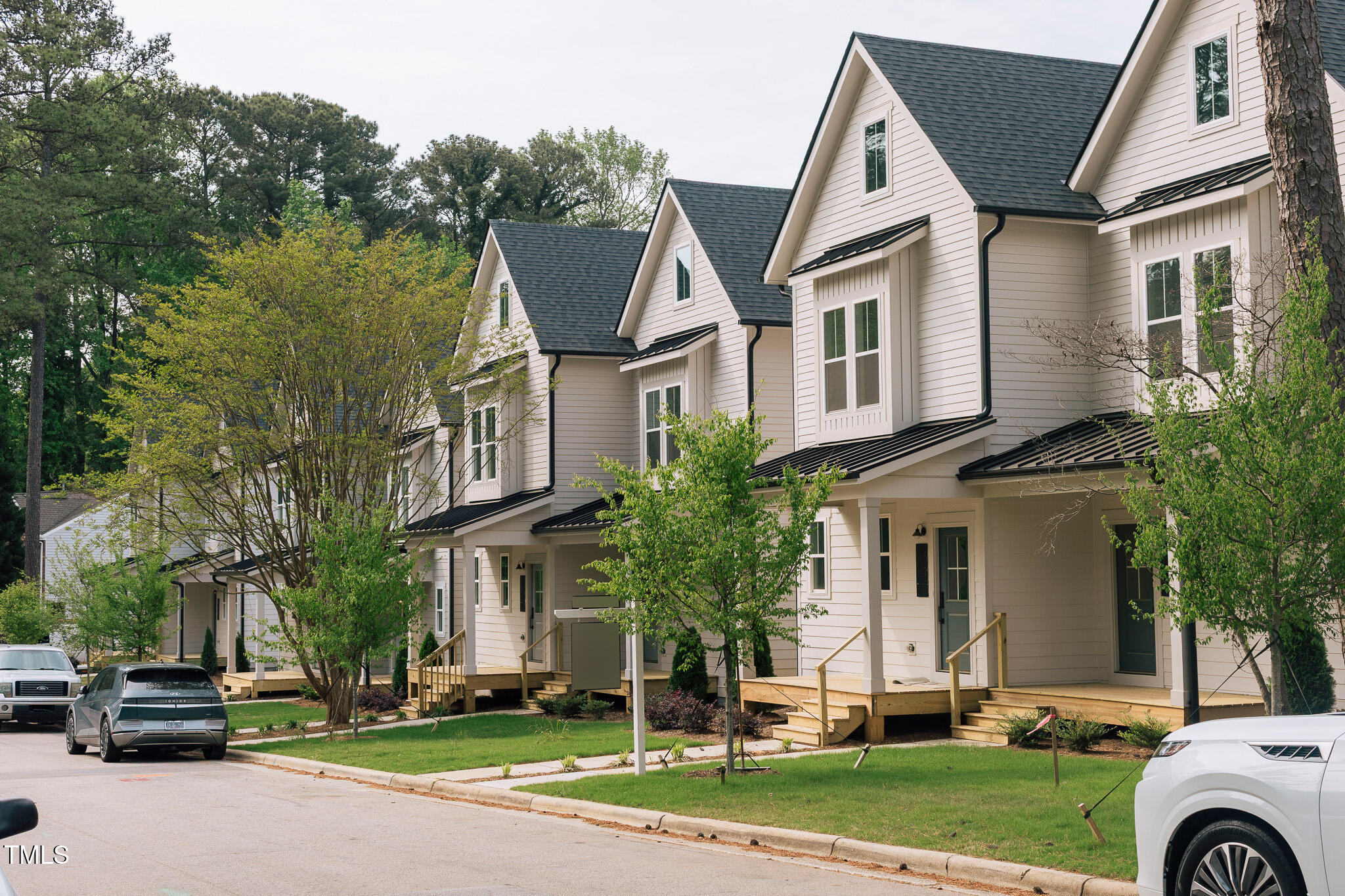 5061 Lundy Drive, Unit 101 Raleigh, NC 27606 - Photo 43 of 56 a front view of a house with a yard