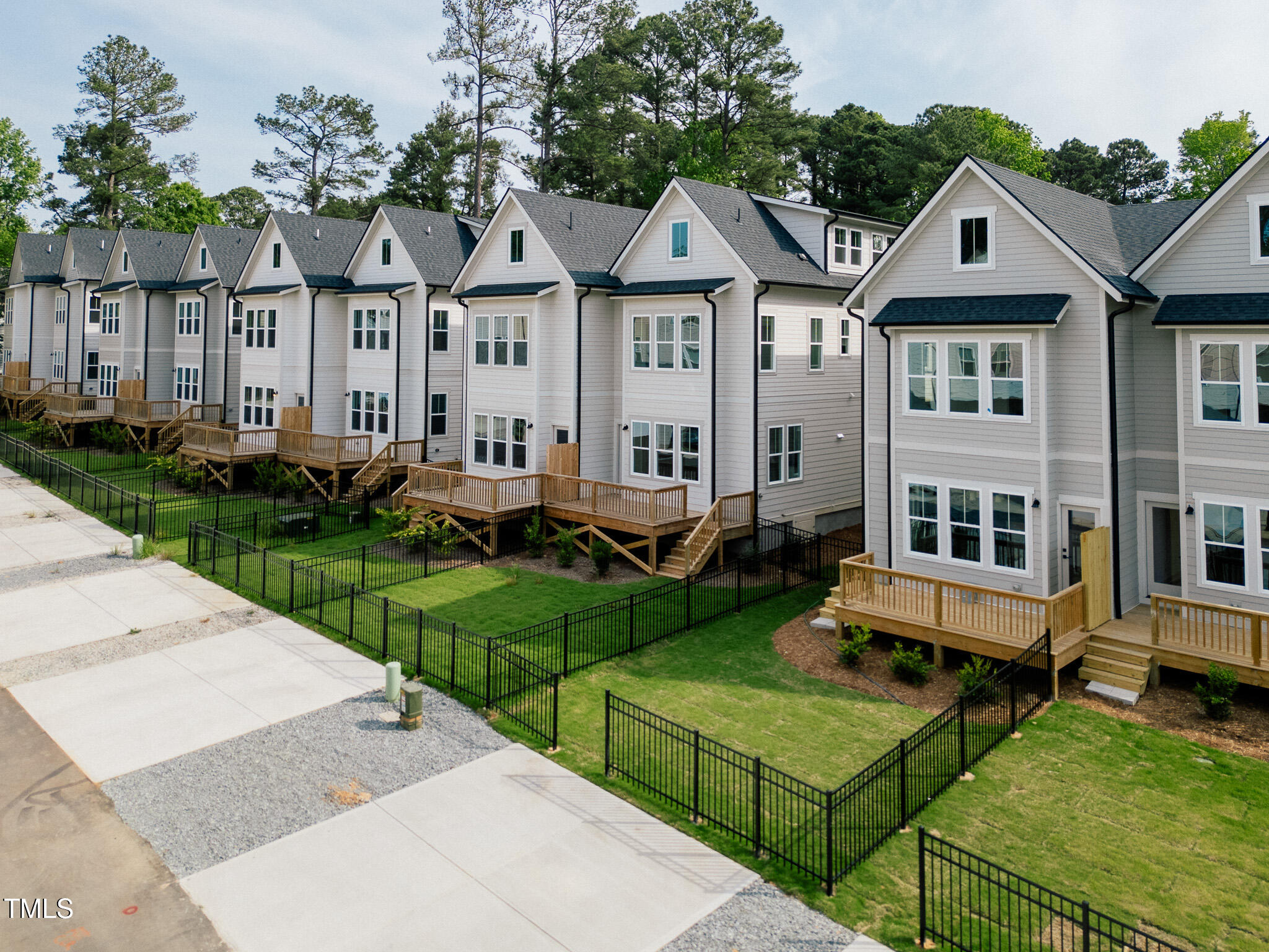 5061 Lundy Drive, Unit 101 Raleigh, NC 27606 - Photo 48 of 56 a front view of a house with yard and green space