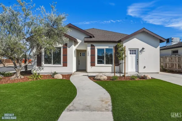 an empty room with a window and a ceiling fan