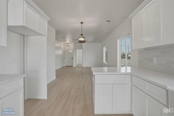 a kitchen with stainless steel appliances granite countertop a stove and a refrigerator