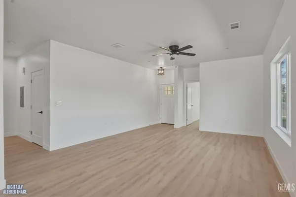 a bathroom with a sink vanity granite toilet and shower