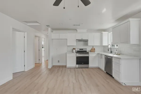 a front view of a house with a yard and porch