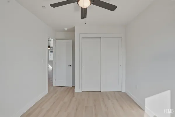 a kitchen with refrigerator cabinets and a sink