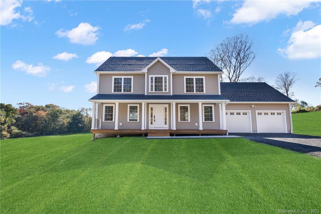 53 Beecher Road Brooklyn, CT 06234 - Photo 1 of 1 a front view of a house with a garden