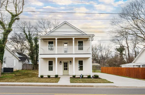 a front view of a house with yard