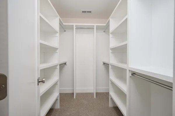 a view of an empty walk in closet