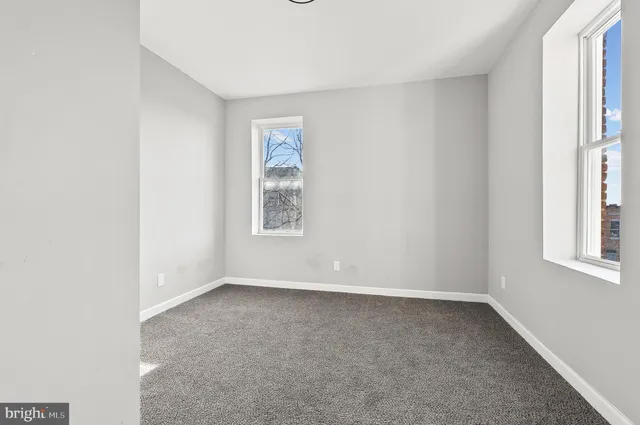 an empty room with windows