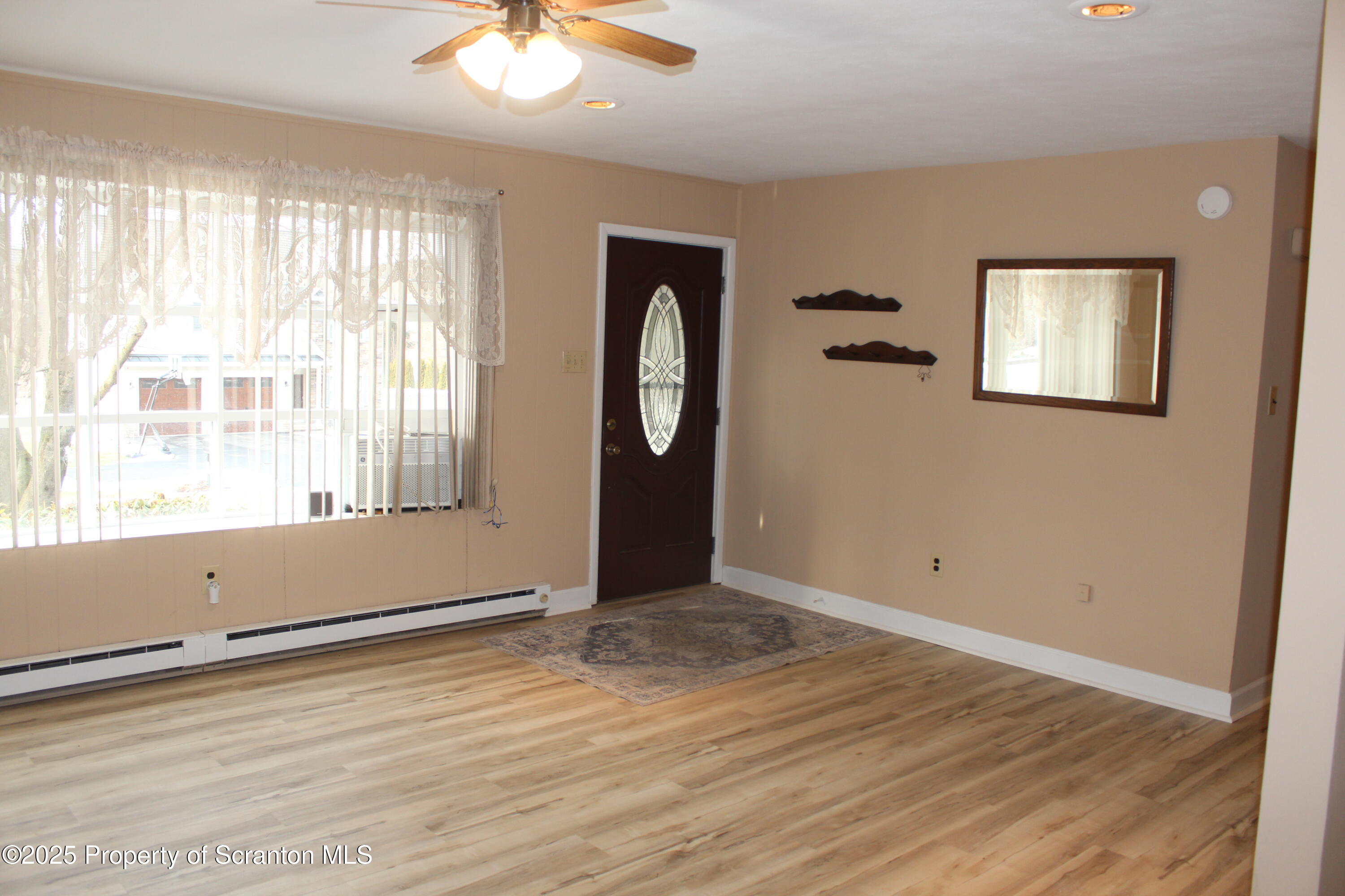347 Terrace Avenue Shavertown, PA 18708 - Photo 15 of 59 a view of an empty room with wooden floor and a window