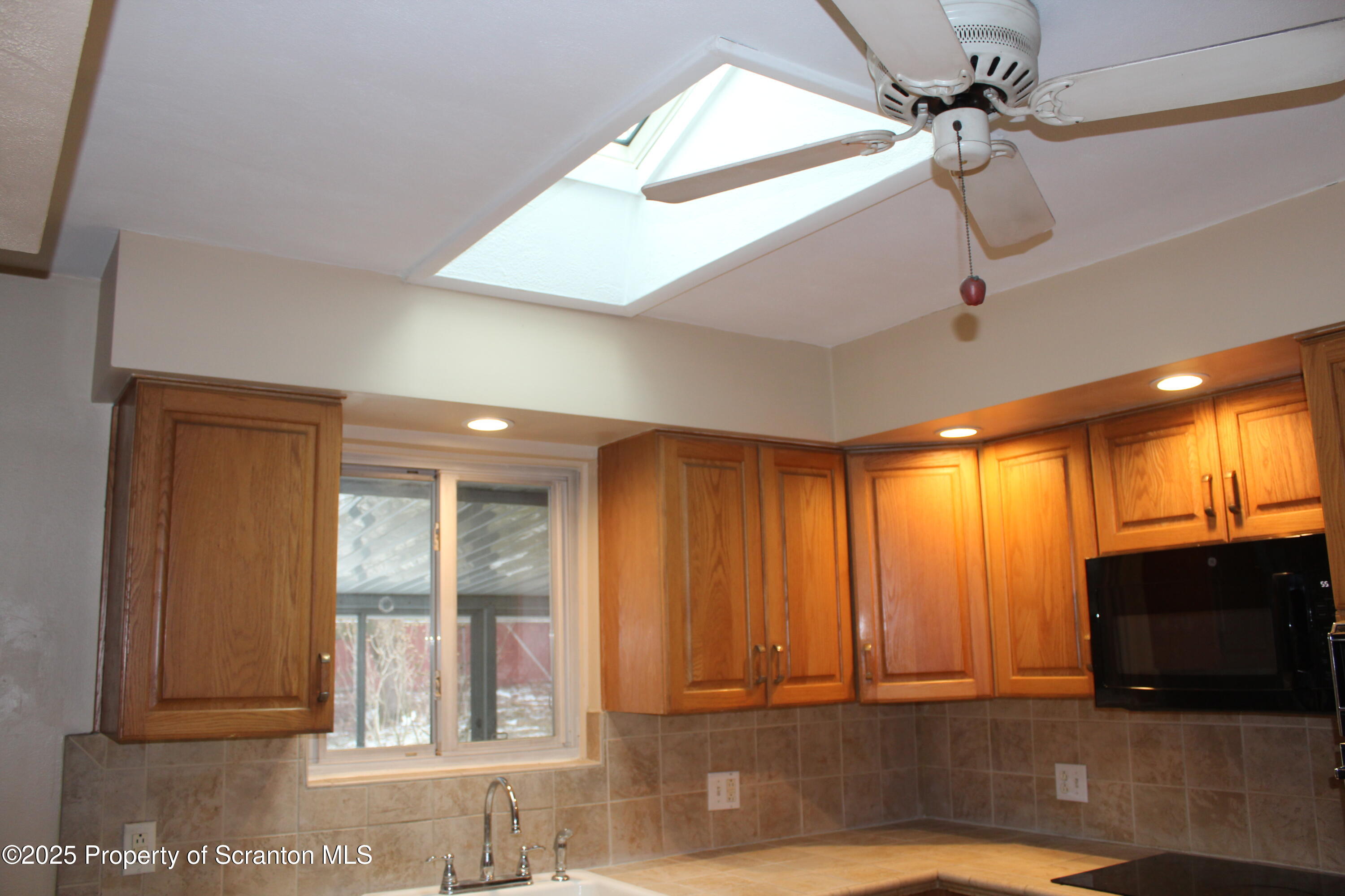 347 Terrace Avenue Shavertown, PA 18708 - Photo 19 of 59 a view of a livingroom with a ceiling fan and window