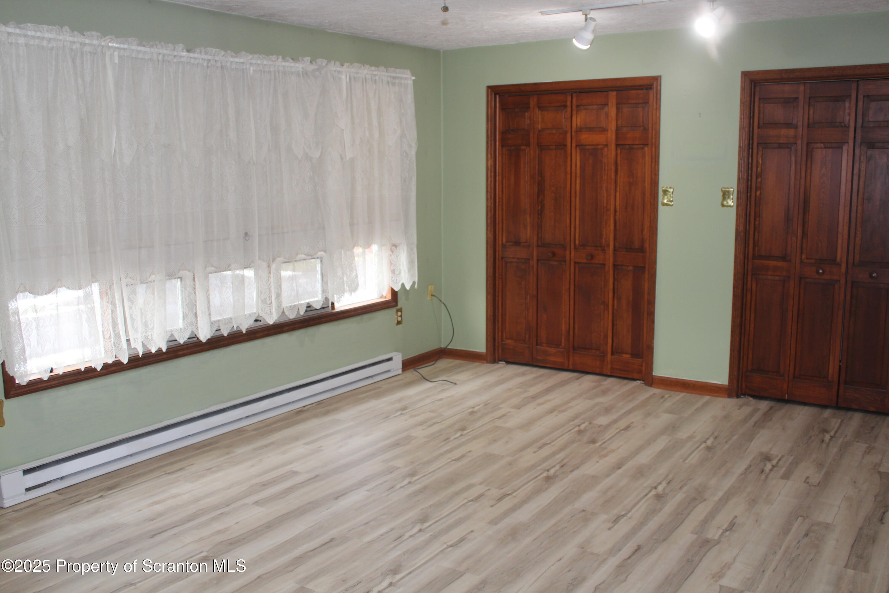 347 Terrace Avenue Shavertown, PA 18708 - Photo 27 of 59 a view of an empty room with wooden floor and a window