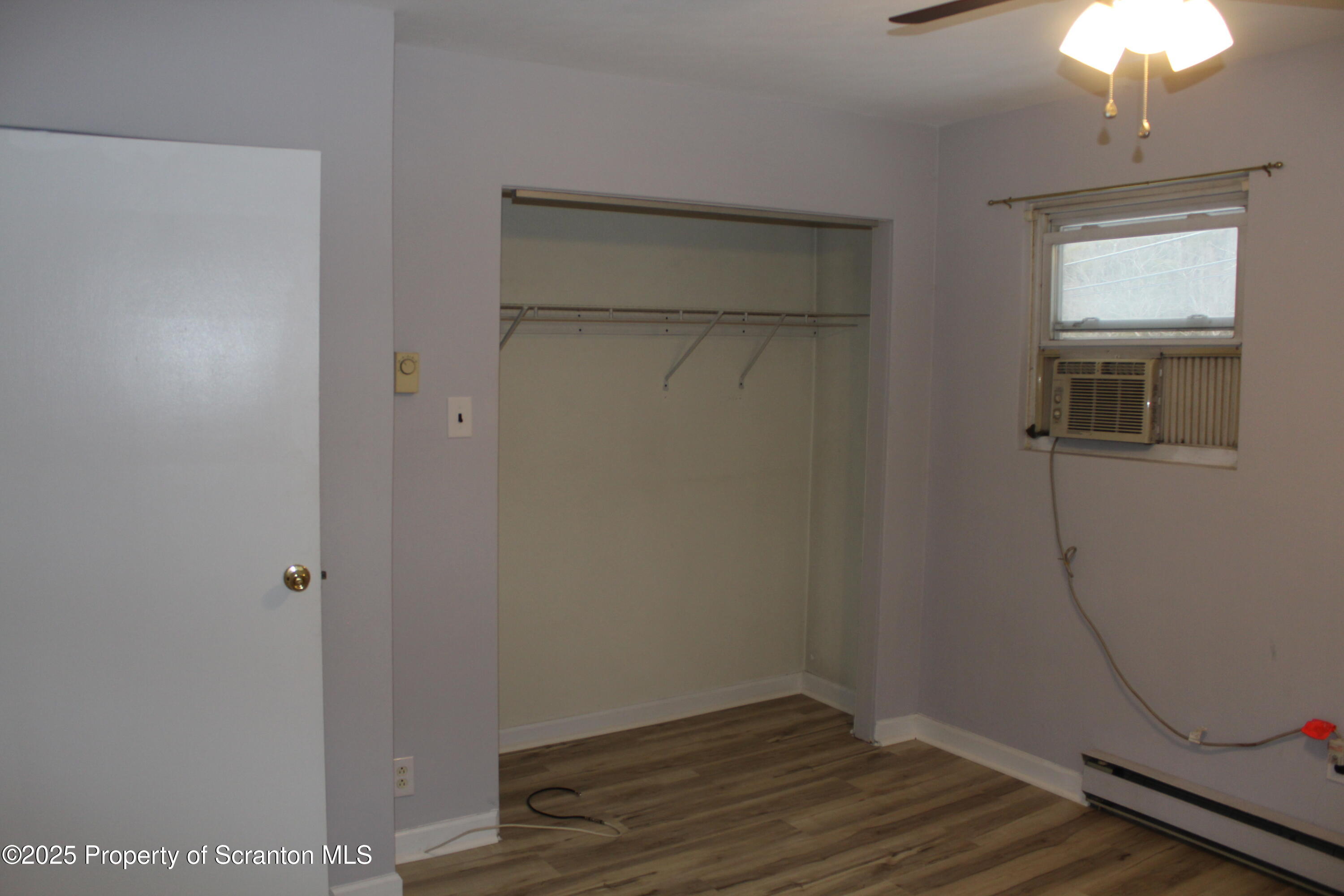 347 Terrace Avenue Shavertown, PA 18708 - Photo 32 of 59 an empty room with wooden floor and windows