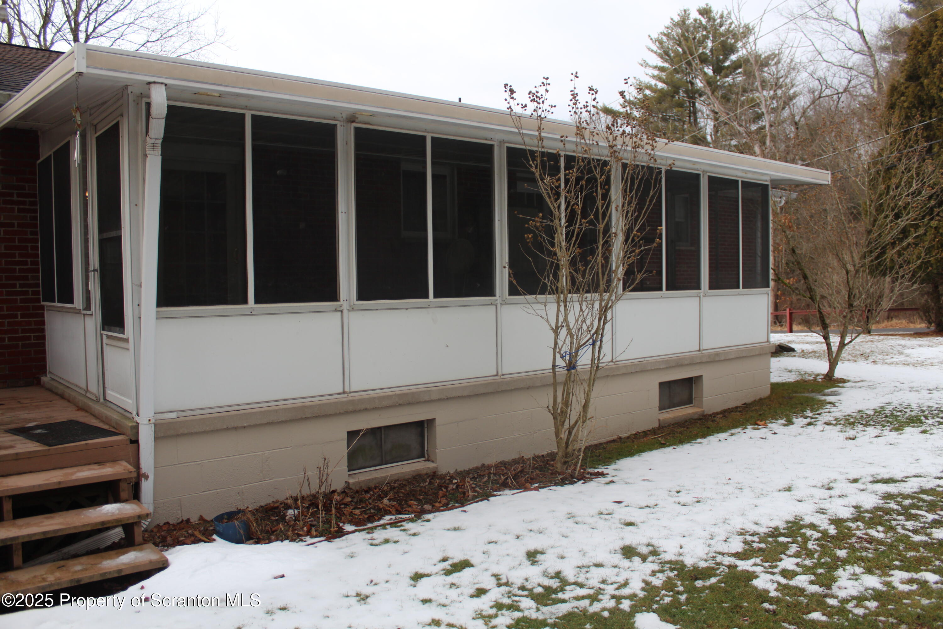 347 Terrace Avenue Shavertown, PA 18708 - Photo 42 of 59 a view of a house with a large window and wooden fence