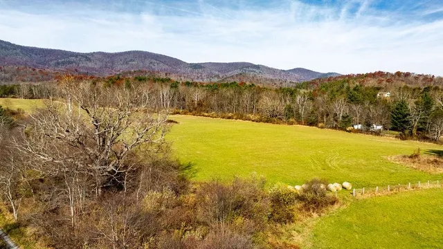 a view of an ocean and a mountain