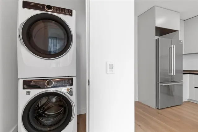 a view of a hallway with washer and dryer