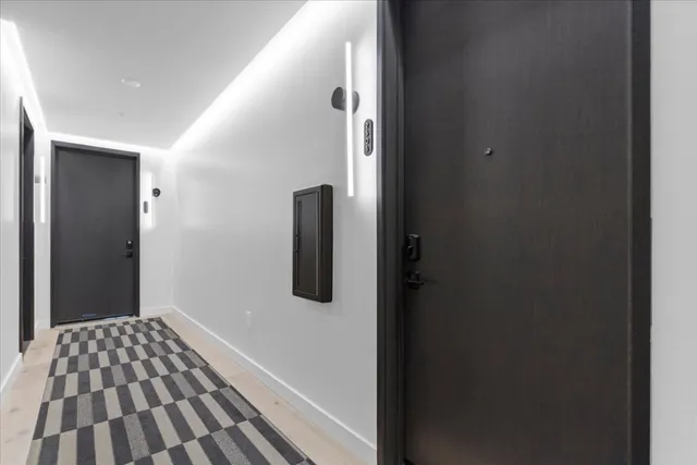 a view of a room with wooden floor