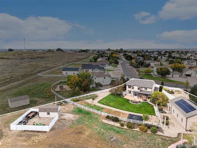 an aerial view of a house with a ocean view