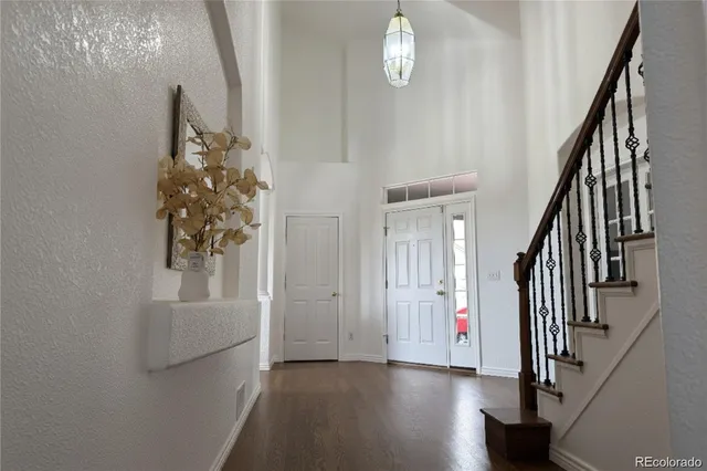 a view of an entryway with wooden floor