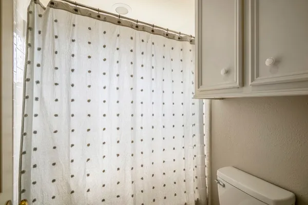a bathroom with a shower curtain