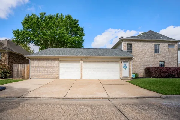 a grey house with yard