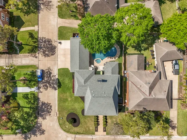 an aerial view of a house with outdoor space