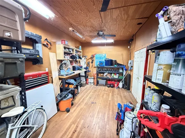 a view of a chairs and tables in a patio