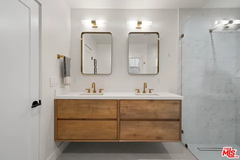 a bedroom with a bed and a night stand