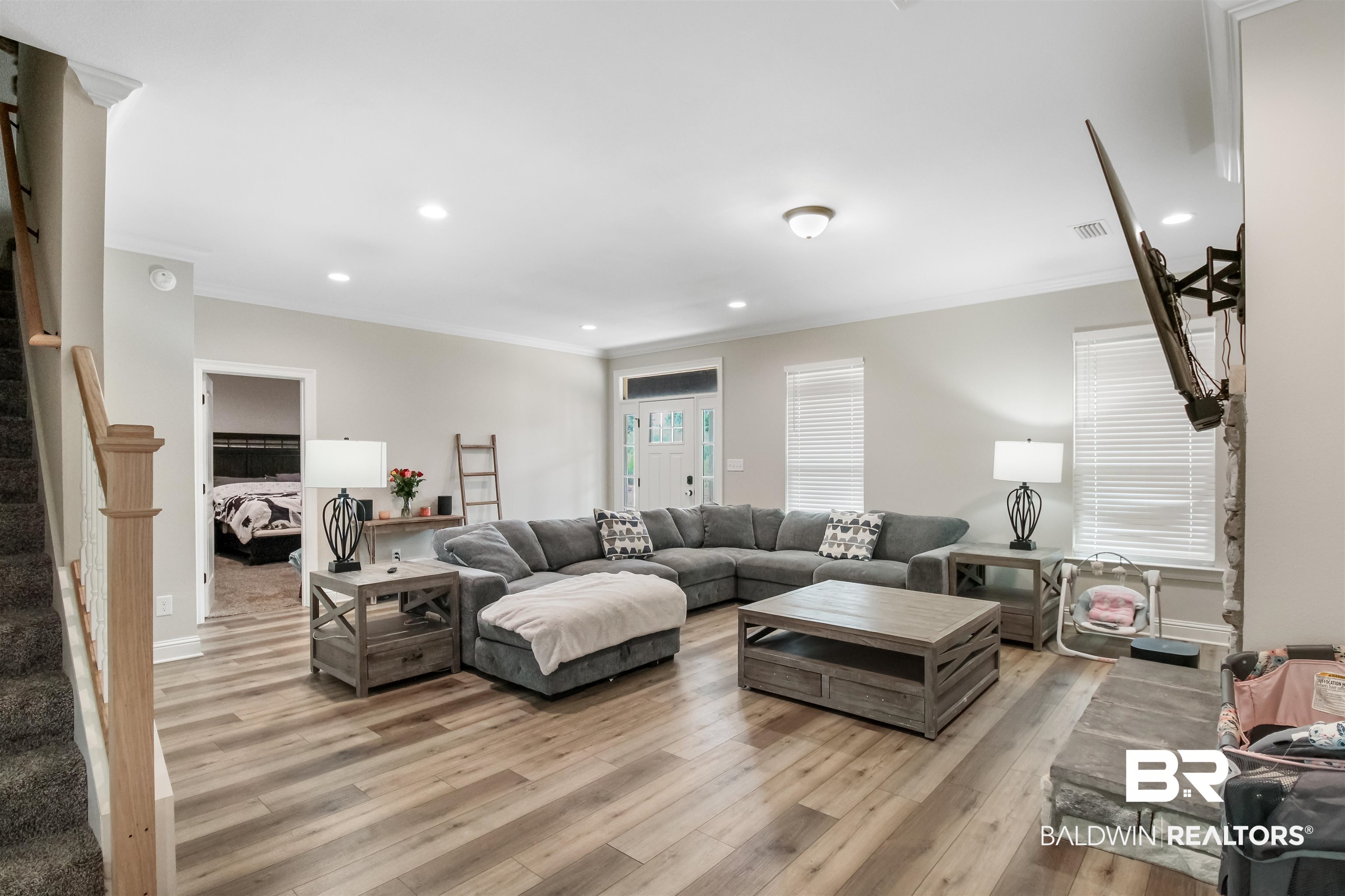 26197 Eagle Trace Elberta, AL 36530 - Photo 2 of 26 Living room featuring crown molding and light hardwood / wood-style floors