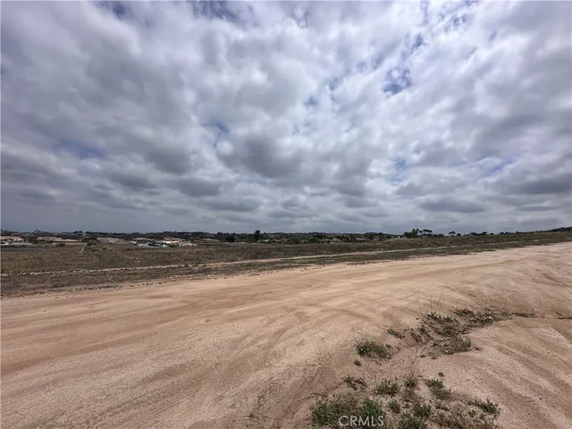 a view of an ocean beach and mountain