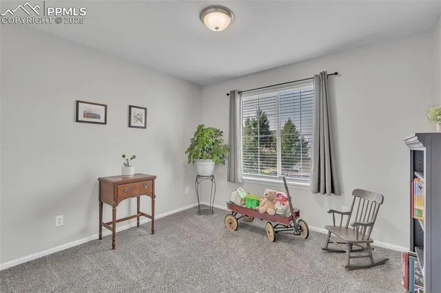 a view of a room with furniture and windows