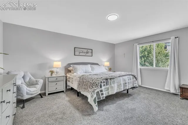 a bed room with a bed and a window