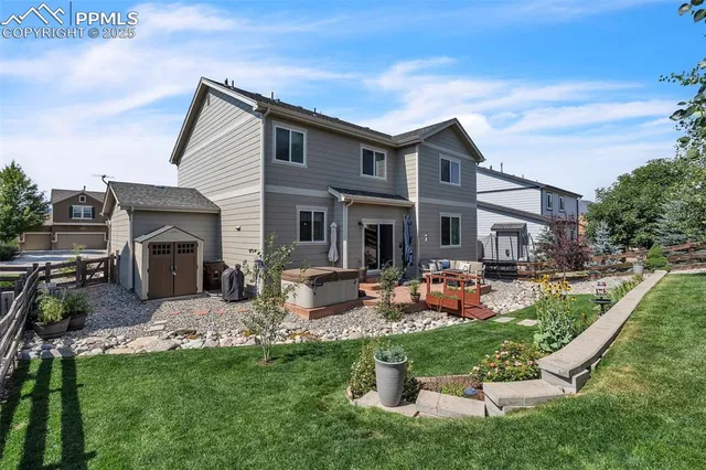 a front view of house with yard and outdoor seating