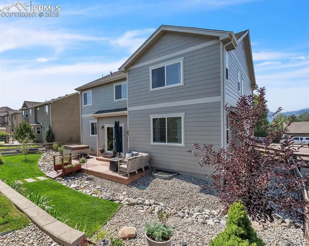 a view of a garden with seating area