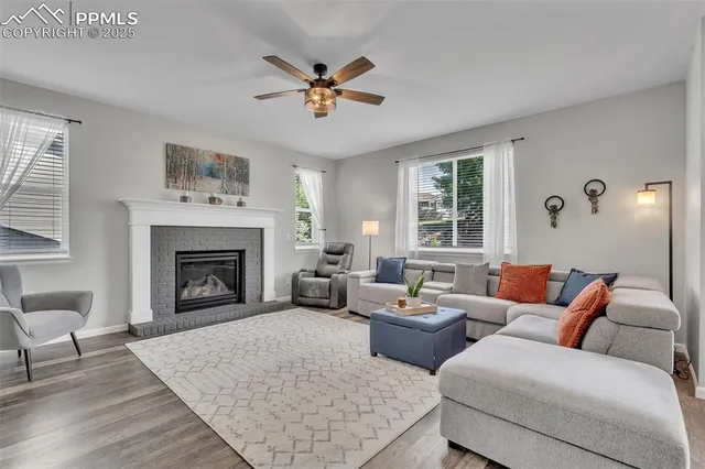 a living room with furniture and a fireplace
