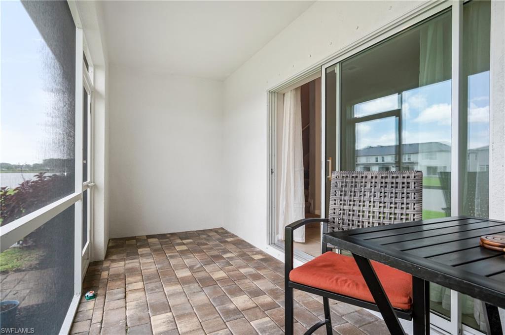 15070 Wildflower Circle Naples, FL 34119 - Photo 12 of 22 a view of an empty room and window