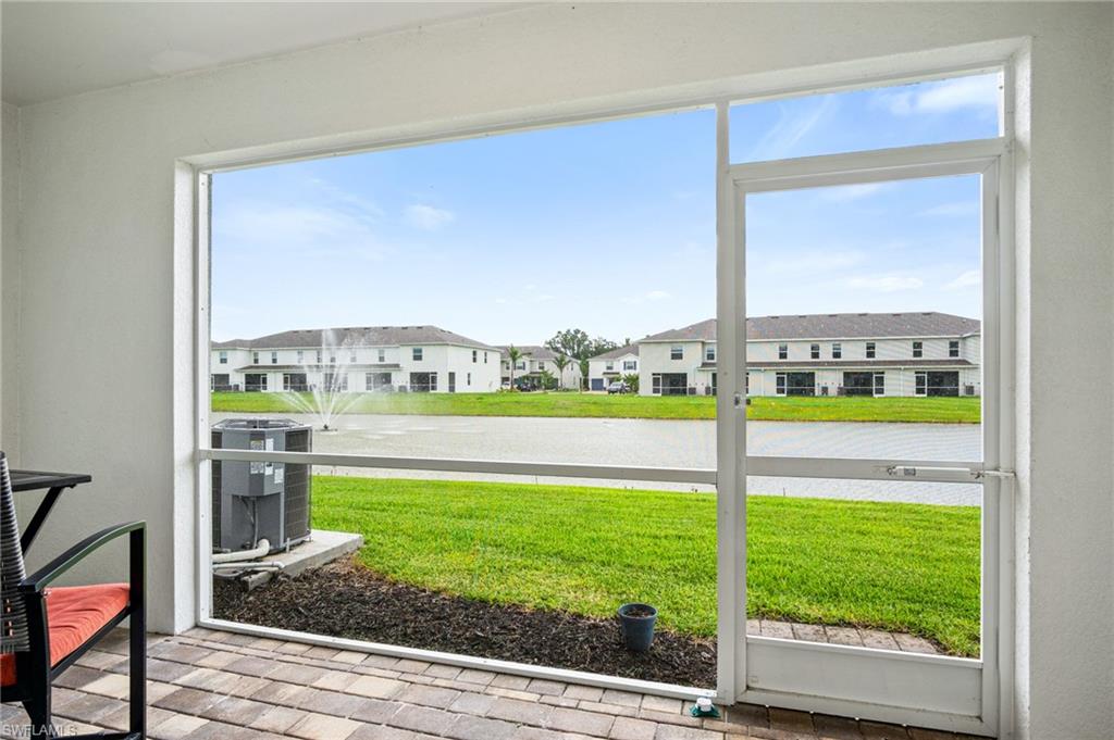 15070 Wildflower Circle Naples, FL 34119 - Photo 13 of 22 a view of water from a living room