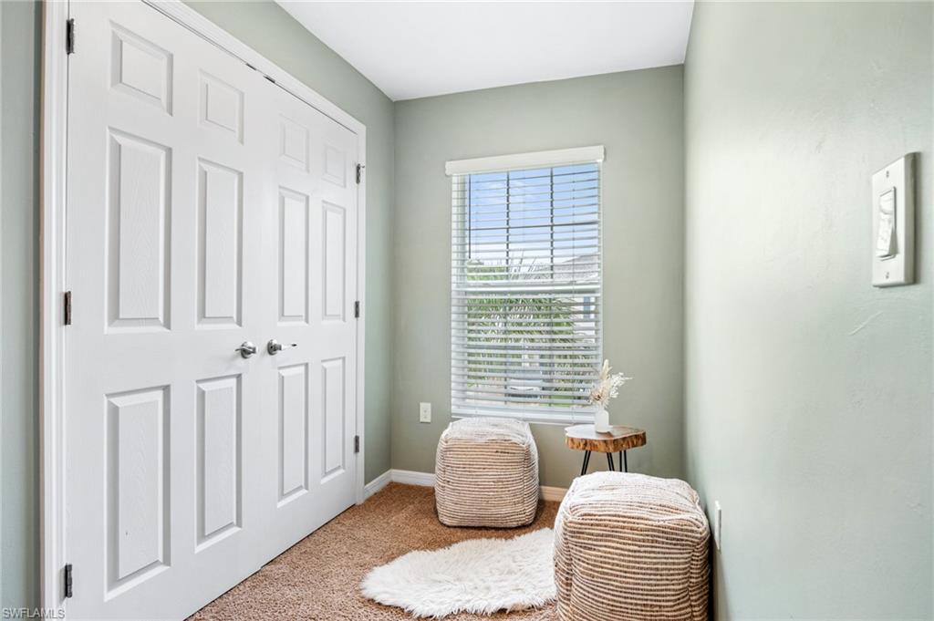 15070 Wildflower Circle Naples, FL 34119 - Photo 19 of 22 a bedroom with furniture and a window