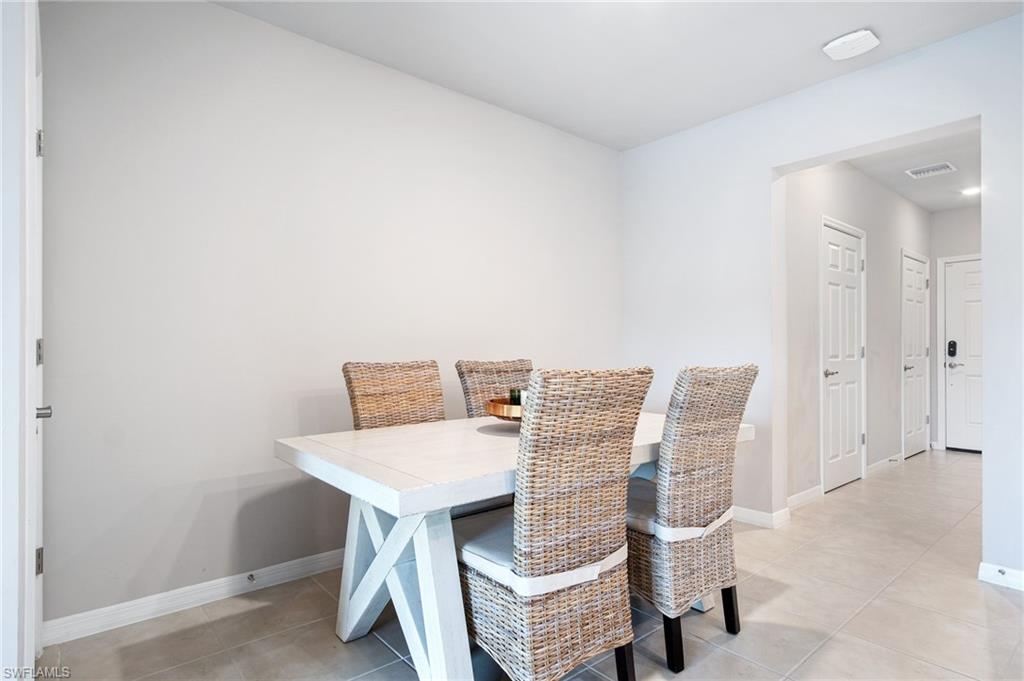 15070 Wildflower Circle Naples, FL 34119 - Photo 5 of 22 a view of a workspace with furniture